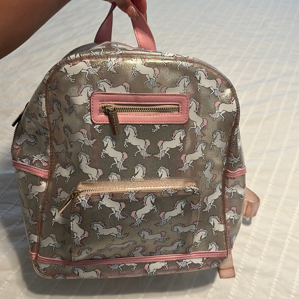 Almost perfect condition, unicorn clear glitter book bag from brand skinnydip.